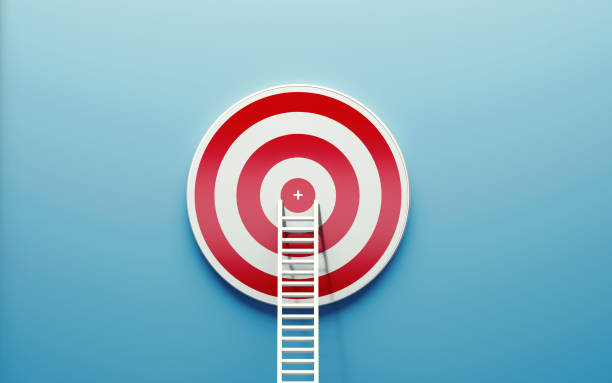 istock White Ladder Leaning on A Target on Blue Wall 1160036175