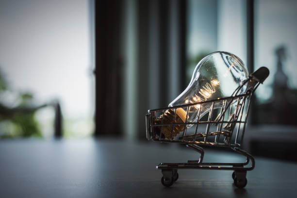 Light bulb with Shopping cart on a white background. Creative light bulb idea, power energy or business idea concept. stock photo