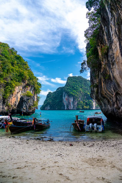 istock A long tail boat on the tropical white sand beach at Krabi, Thialand. 1160037103
