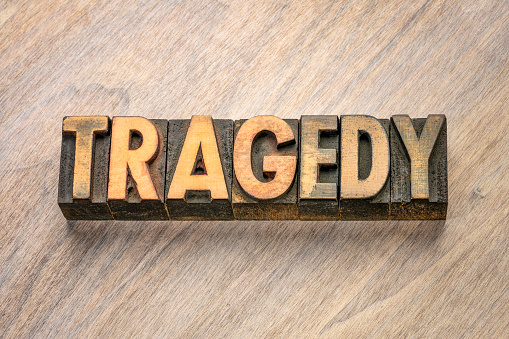 tragedy word abstract in vintage letterpress wood type printing blocks