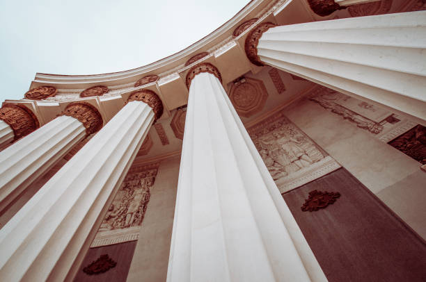 low angle view of roman style architectural columns - column courthouse justice government imagens e fotografias de stock