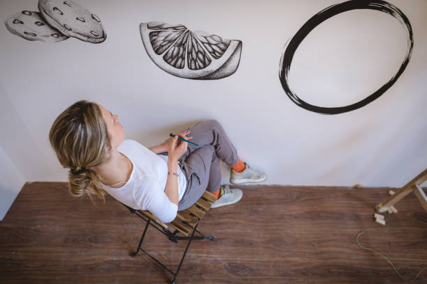 istock Serene young woman illustrating the wall 1160041109