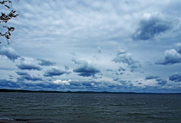 istock heavy gray clouds over the lake on a cloudy evening 1160042333