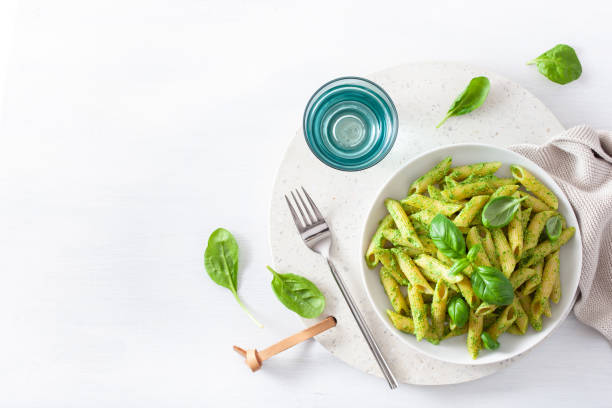 istock penne pasta with spinach basil pesto sauce 1160042508