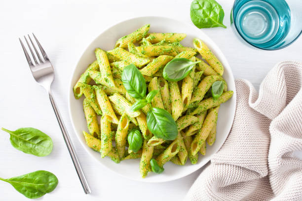 istock penne pasta with spinach basil pesto sauce 1160042664