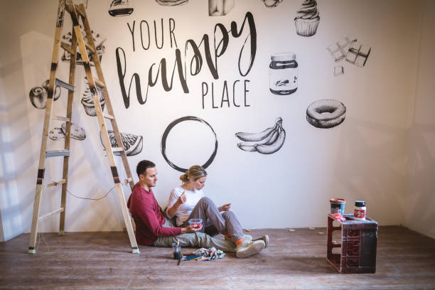 istock Beautiful serene couple of painters having a break during work 1160043289