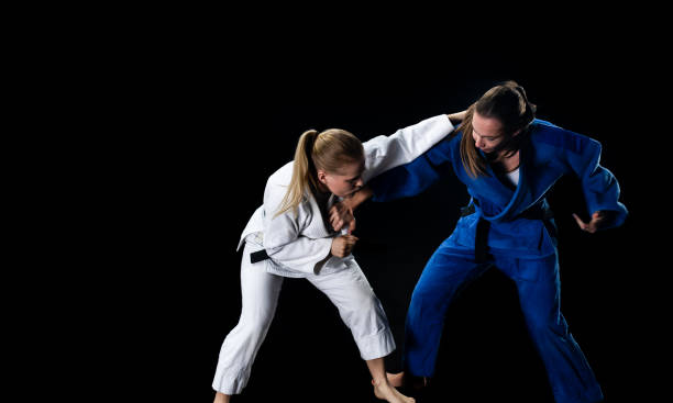 istock Female Judo Players Competing During Match 1160043692