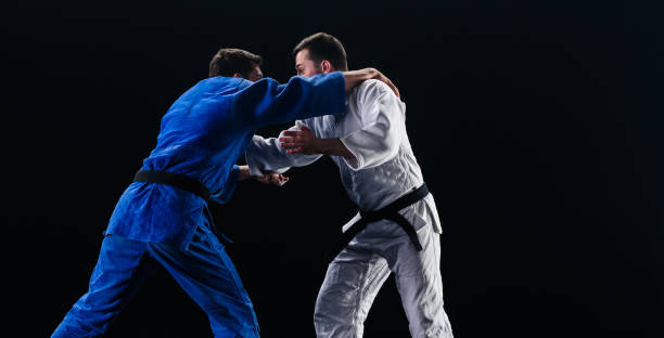 istock Male Judo Players Competing During Match 1160043731