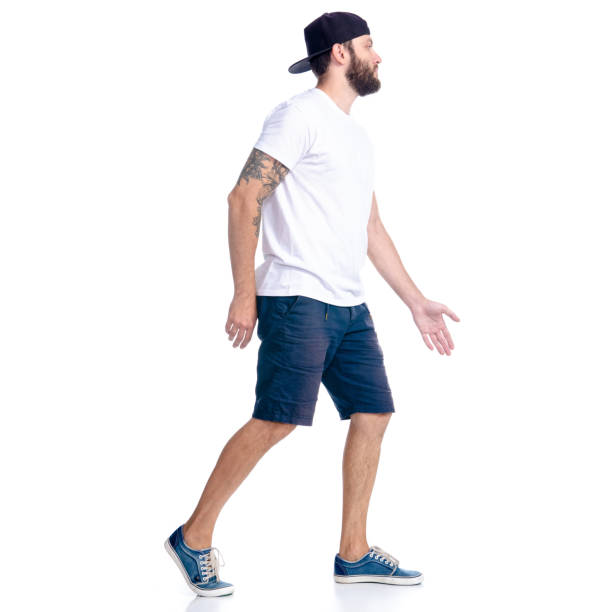 istock Man in shorts and cap standing goes walking running 1160044978