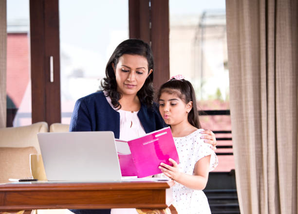 istock Mother helping daughter with homework 1160045998