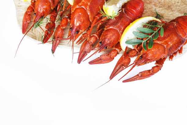 istock Close-up of boiled crawfish with lemon and herbs 1160046352
