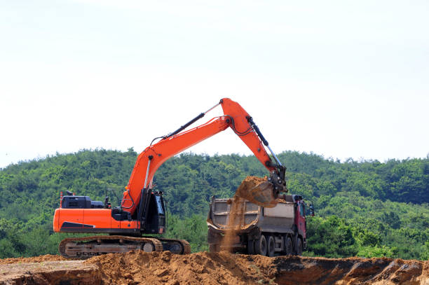 istock Excavator and Dumer truck 1160047748