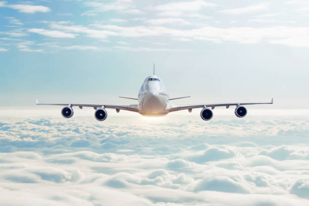 Cloudscape view with airplane is flying in the daytime sky cumulus clouds.