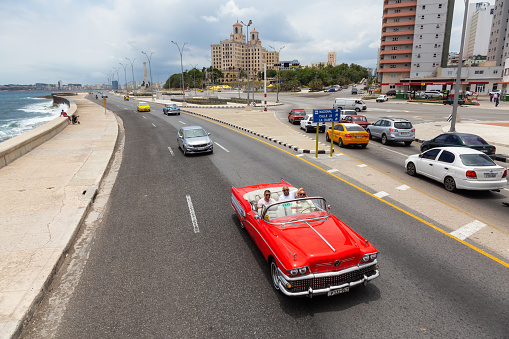 Havana, Cuba - May 23, 2019: Aerial View of an Old Classic American Car in the streets of the Old Havana City during a vibrant and bright sunny day.