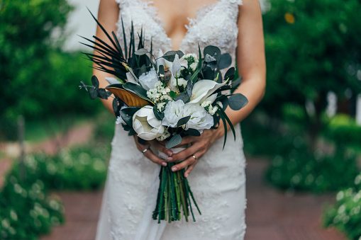 Bouquet of the bride in hands, eucalyptus