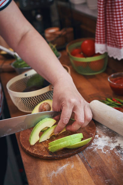 istock Preparing Vegetarian Avocado Pizza with Cottage Cheese and Chili 1160056638