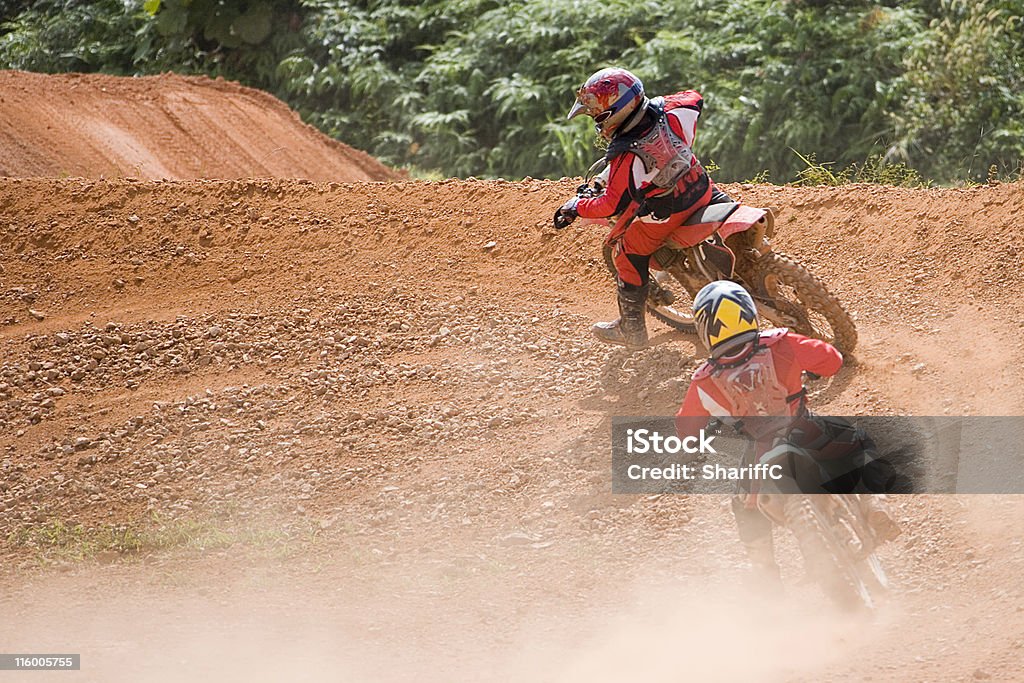 Motocross Image of motocross participants in action. Adult Stock Photo