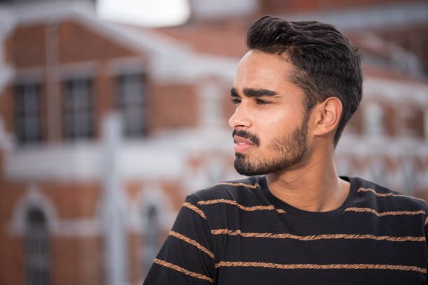 istock Male model posing in front of old industrial river 1160060581