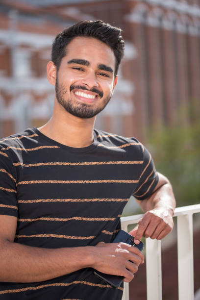istock Male model posing in front of old industrial river 1160060602
