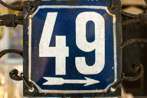 istock Weathered enameled plate number 49 1160061566