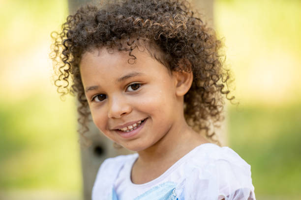 istock Smiling little girl looking at the camera 1160061651