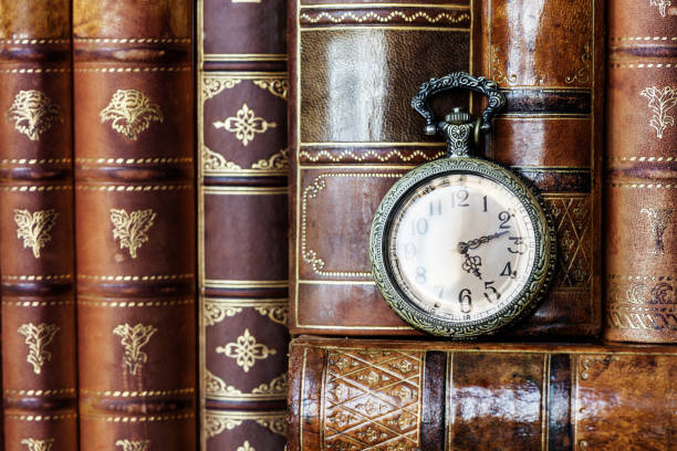 istock Pocket watch and old books 1160061878