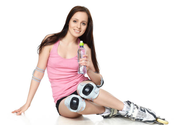 istock The beautiful young woman in rollerskates. 1160061909