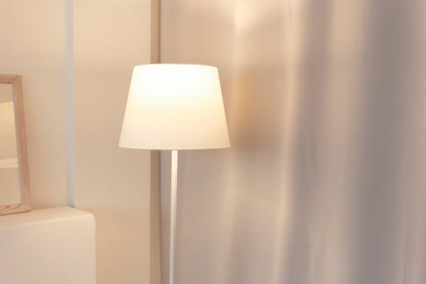 istock Soft color room with floor lamp switched on 1160066711