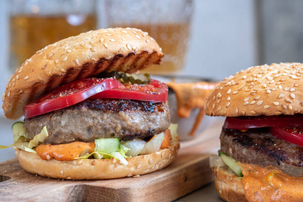 istock Two delicious homemade burger with beef, tomatoes and cucumber 1160073748
