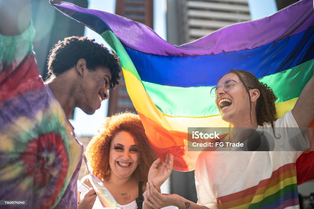 Group of friends enjoying the LGBTQI parade LGBTQIA Rights Stock Photo