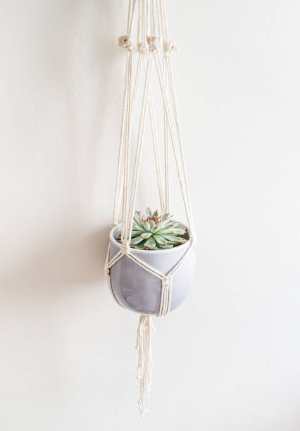 istock Handmade macrame ornamental flowerpot on white background. Embroidery. Scandinavian design 1160077789