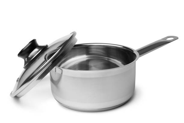 Studio shot of stainless steel Casserole with handles, covered with transparent glass lid, isolated on white background - directly above.
