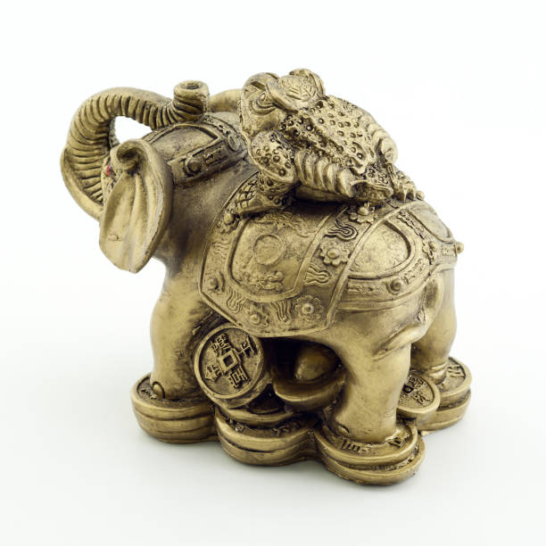 istock Bronze elephant and a frog on a white background 1160078232