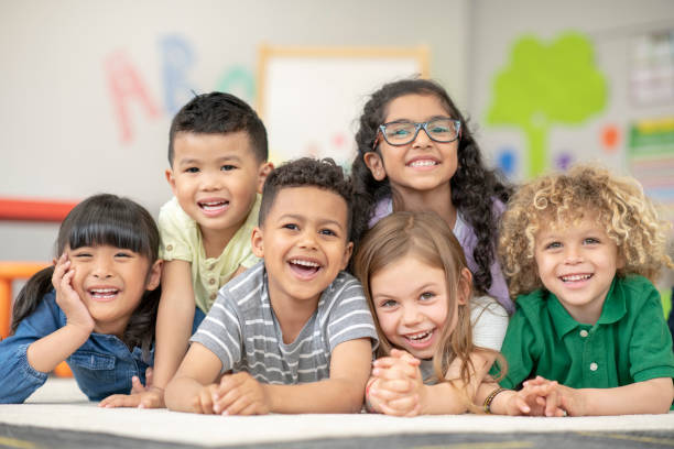 istock A group of smiling kindergarten students 1160082338