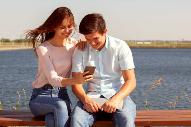 istock Happy couple in love walking in park 1160088708