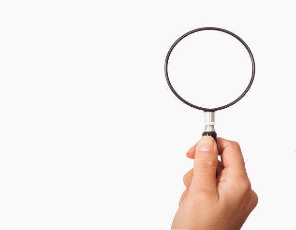 istock magnifying glass holding hand for research 1160091547