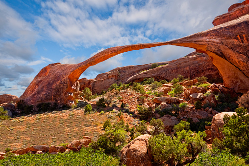 Landscape Arch is a 306 foot span of sandstone that has slowly been eroding away for centuries. On September 1, 1991 a 60 foot long slab of the rock peeled away, leaving 180 tons of rock debris below the arch. Landscape Arch is in the Devil's Garden area of Arches National Park near Moab, Utah, USA.