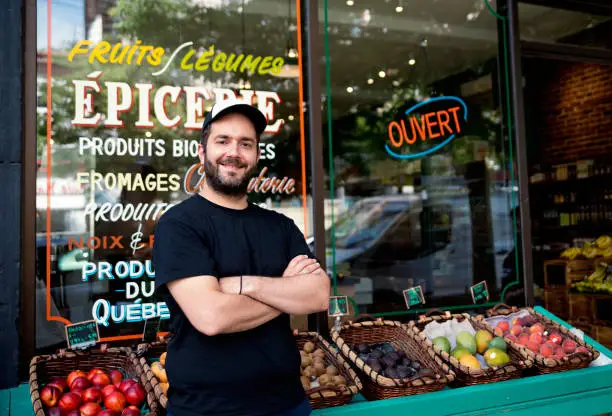 Photo of Owner of small zero waste oriented grocery store.