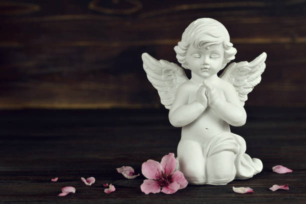 istock Guardian angel kneeling and praying 1160092699