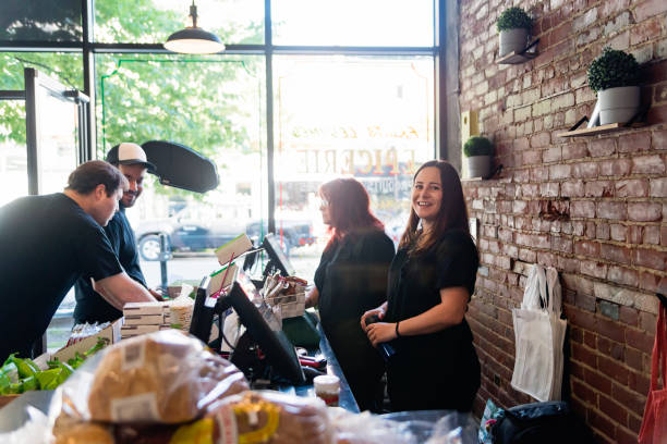 employees opening small zero waste oriented grocery store. - environment homegrown produce canada north america imagens e fotografias de stock