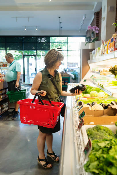 istock Customers shopping in small zero waste oriented fruit and grocery store. 1160092878