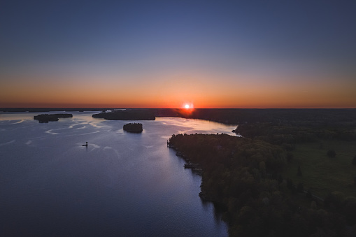 Drone/aerial image taken during sunset over Lake Muskoka. Located near Bracebridge, Ontario, Canada.
