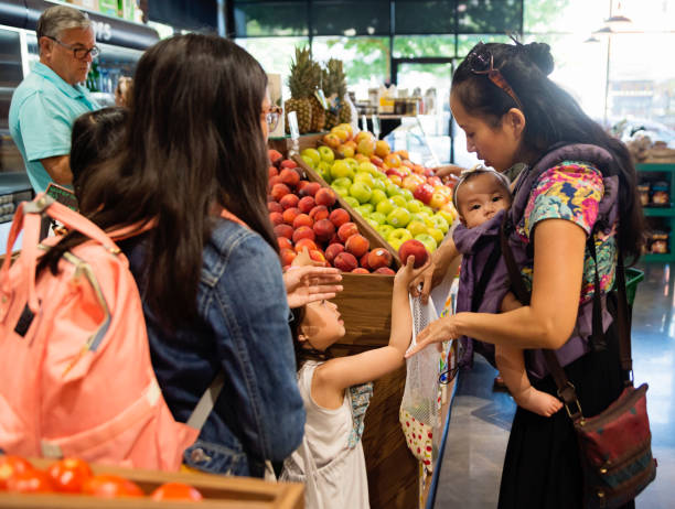 istock Customers shopping in small zero waste oriented fruit and grocery store. 1160092898