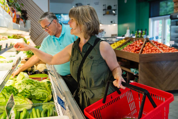 istock Customers shopping in small zero waste oriented fruit and grocery store. 1160092928