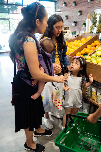 istock Customers shopping in small zero waste oriented fruit and grocery store. 1160092994