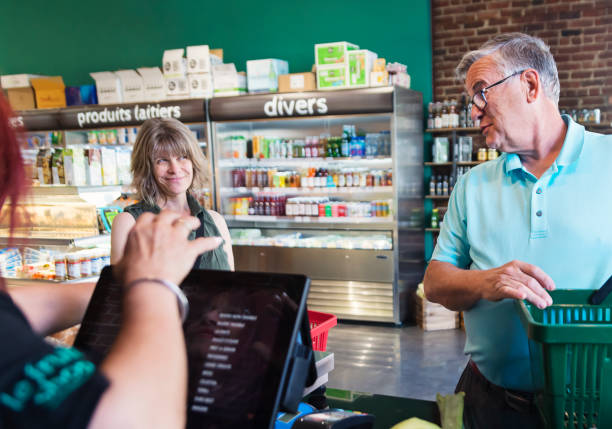 istock Customers shopping in small zero waste oriented fruit and grocery store. 1160093086