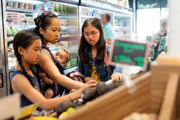 istock Customers shopping in small zero waste oriented fruit and grocery store. 1160093126