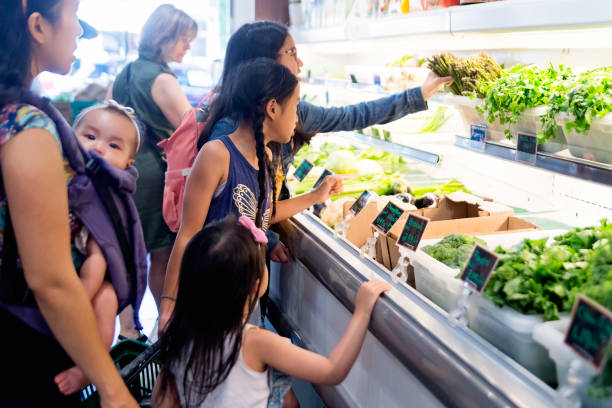 istock Customers shopping in small zero waste oriented fruit and grocery store. 1160093252