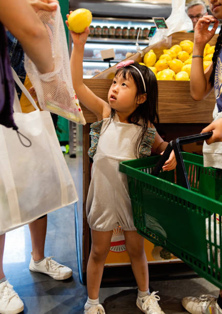 istock Customers shopping in small zero waste oriented fruit and grocery store. 1160093950