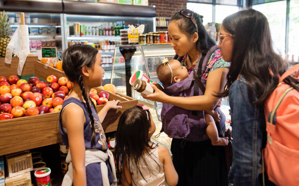 Customers shopping in small zero waste oriented fruit and grocery store.